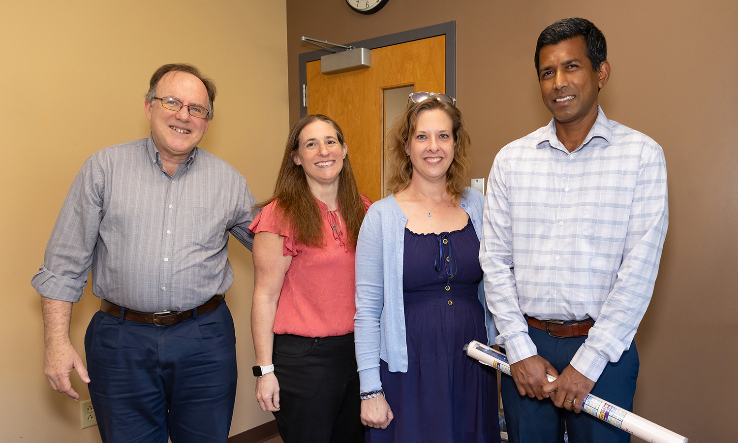 Faculty members and past recipients from left to right includeProfessors Tim Vercellotti, Alison Castellano, and Tara Grealis standing with 2026 TEA winner Nuwan De Silva 